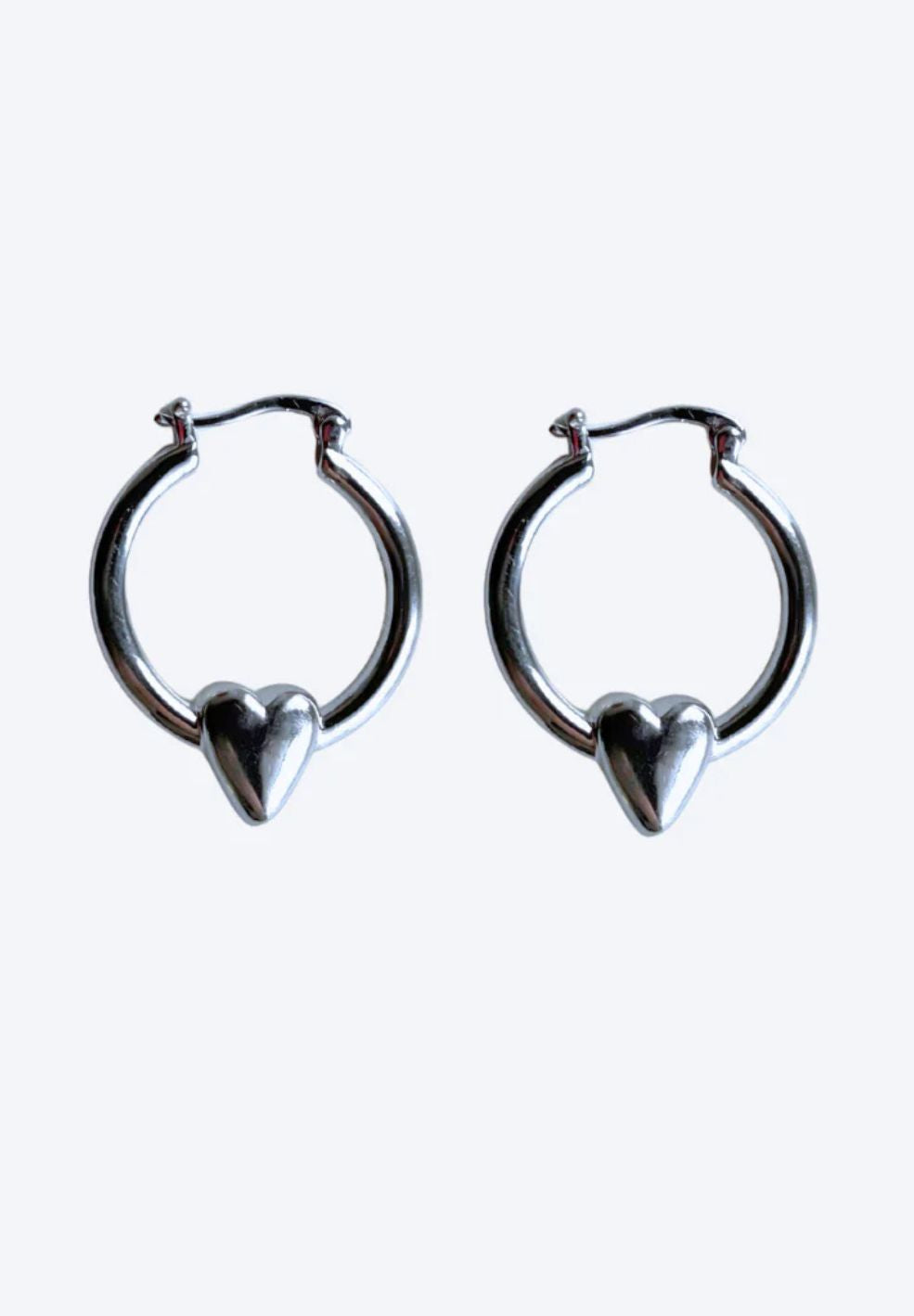 Pair of silver stainless steel hoop earrings with a delicate heart detail, 30mm.
