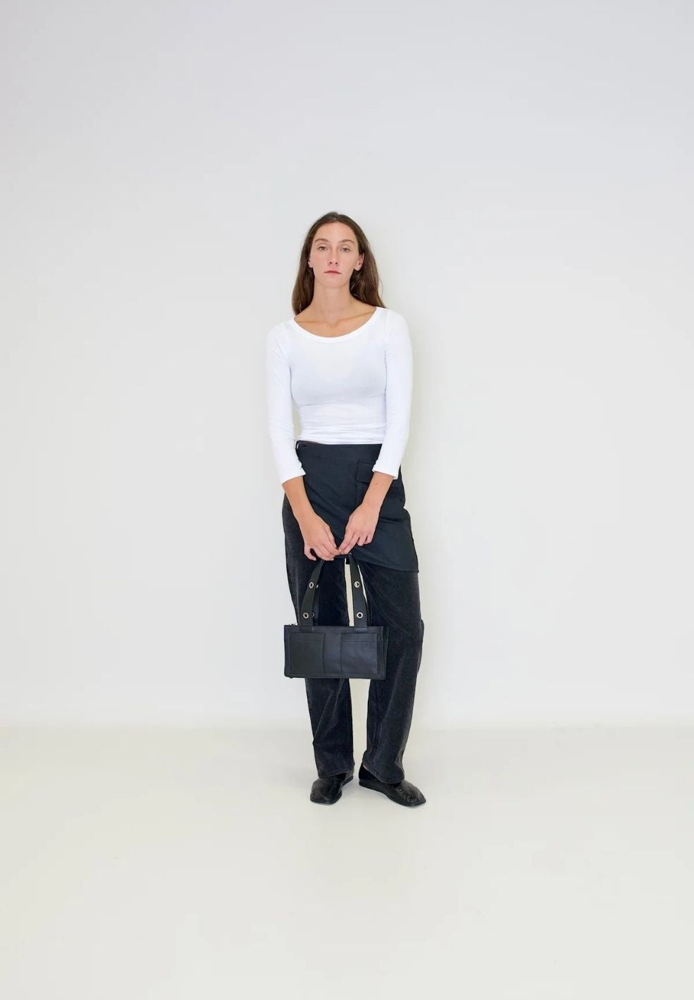 Mini Muse Shoulder Bag Black from 100% nappa leather on model 2 | Verse Good Store