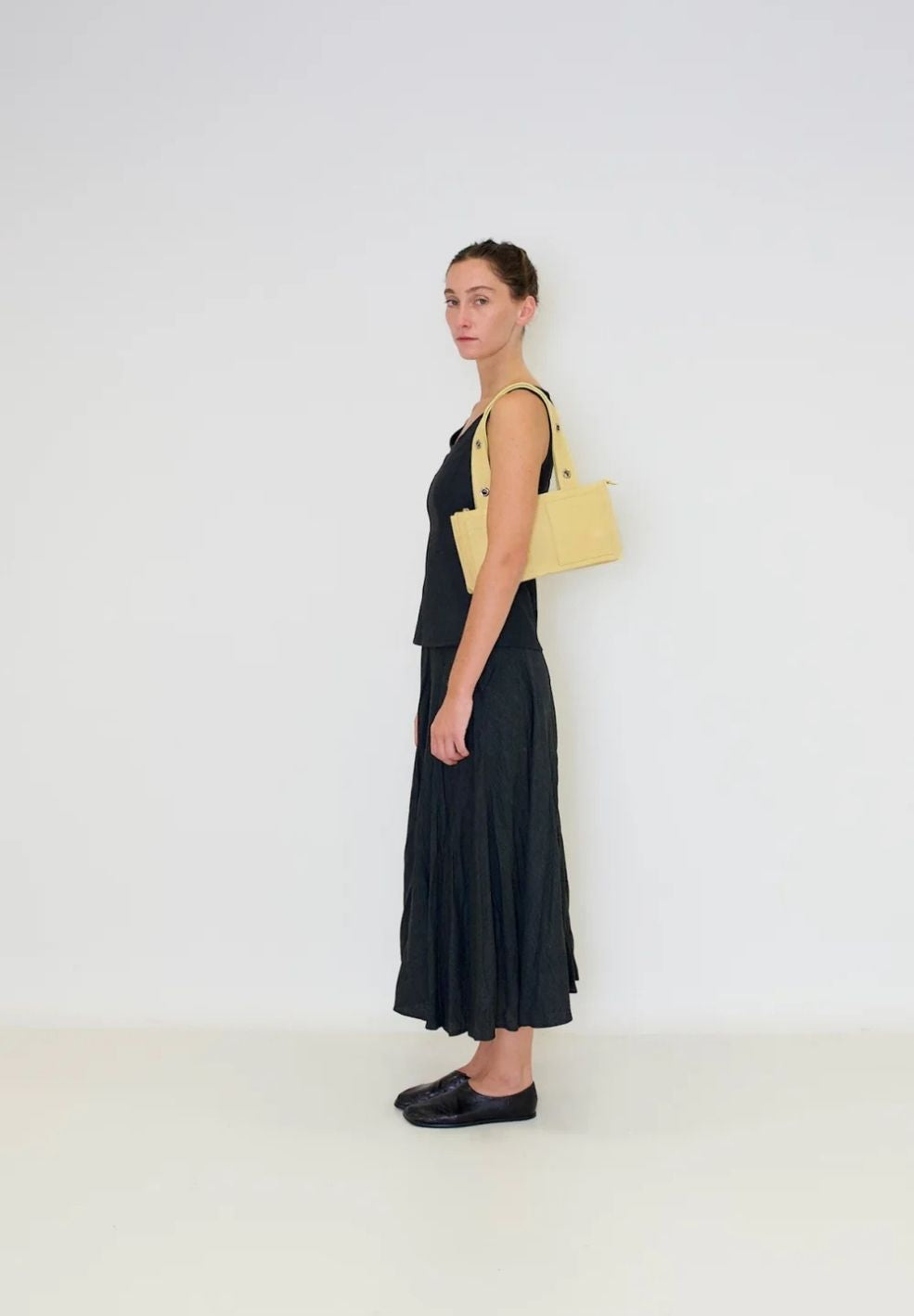 Mini Muse Shoulder Bag Butter from 100% nappa leather on model 1 | Verse Good Store