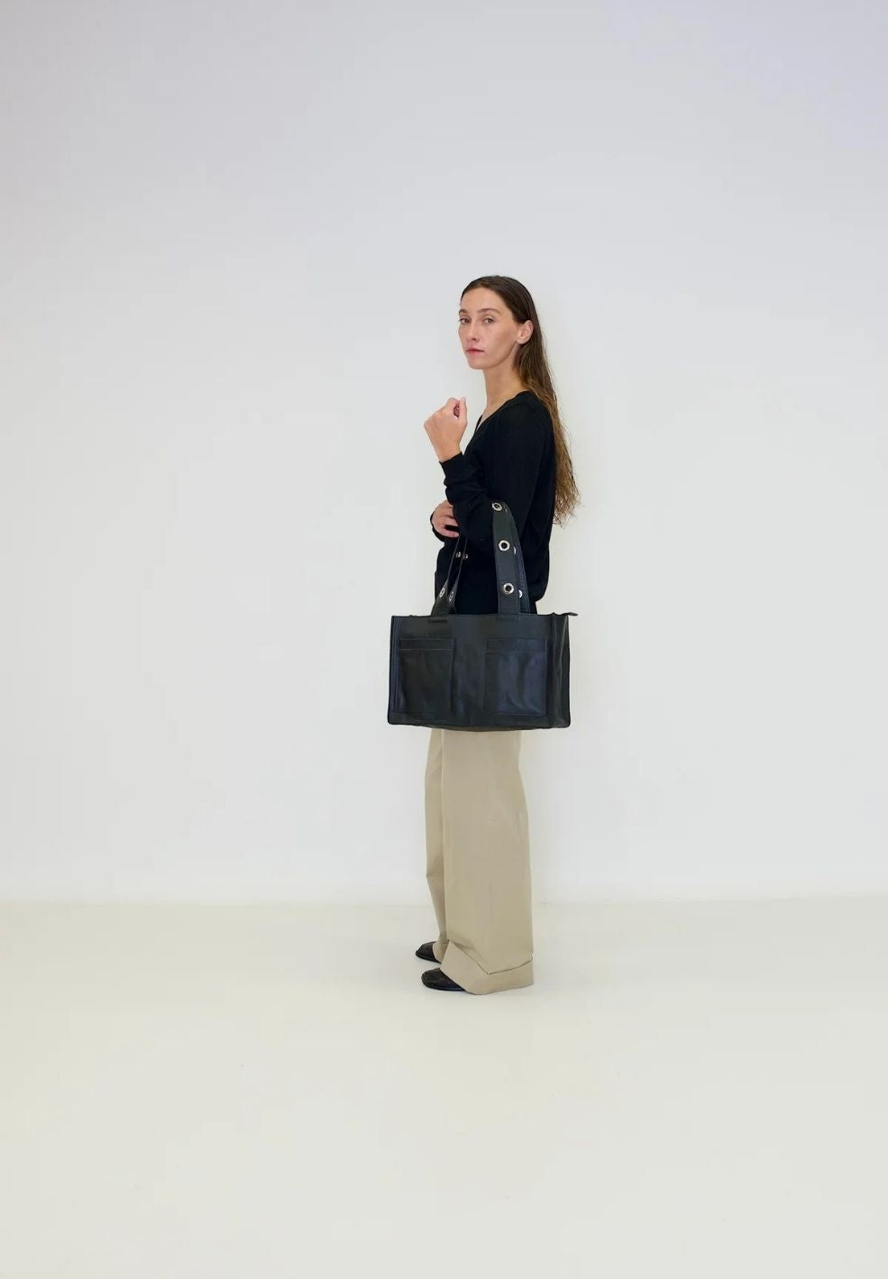 Muse Shoulder Bag Black from 100% nappa leather on model 1 | Verse Good Store